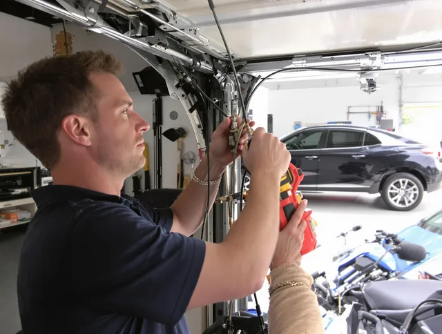 Fort Collins Garage Door Repair safety certified technician performing cable replacement in Fort Collins