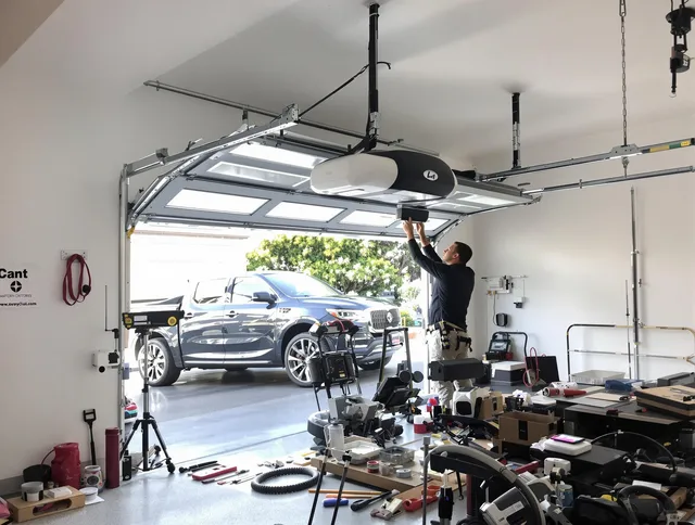Fort Collins Garage Door Repair specialist installing smart garage door opener system in Fort Collins home