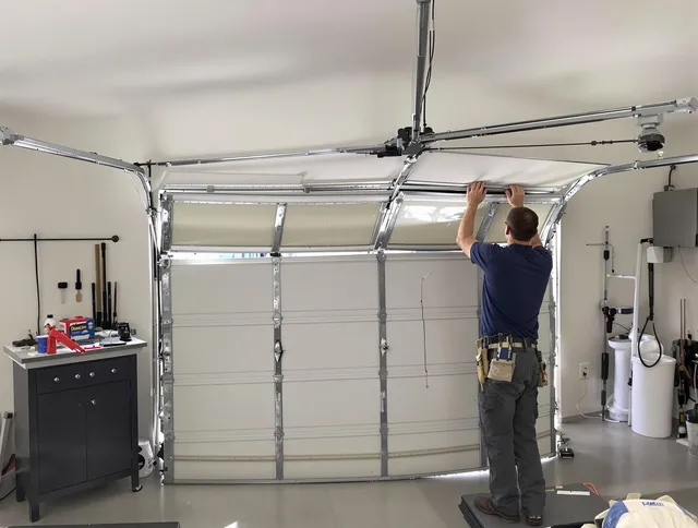 Fort Collins Garage Door Repair specialist performing precise section replacement on Fort Collins garage door